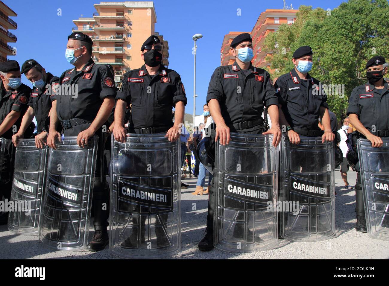 Carabinieri garrisoned the red area of the former Cirio palaces . With their protective shields and baton they keep demonstrators away. Stock Photo