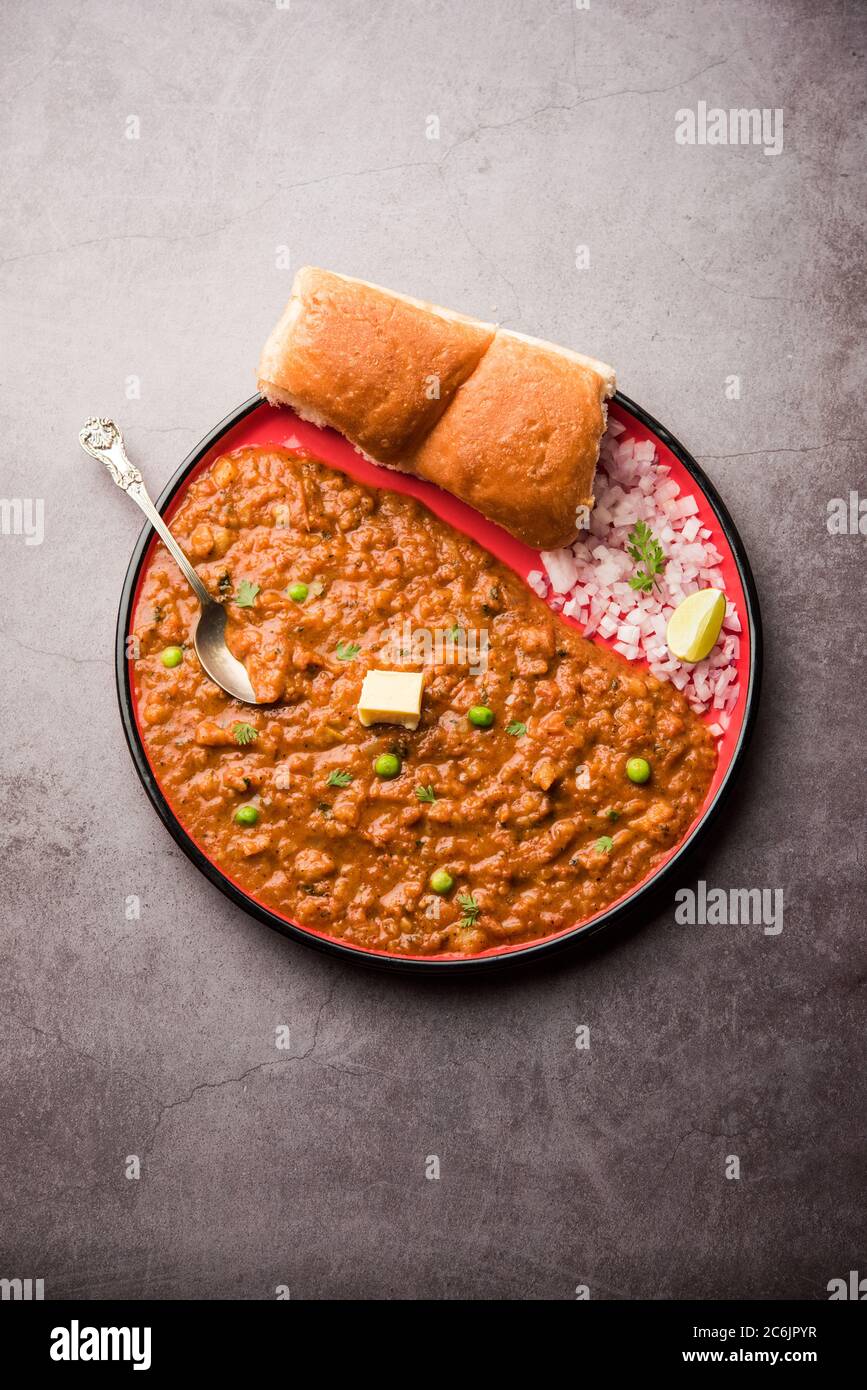 Mumbai Style Pav bhaji is a fast food dish from India, consists of a thick  vegetable curry served with a soft bread roll, served in a plate Stock  Photo - Alamy