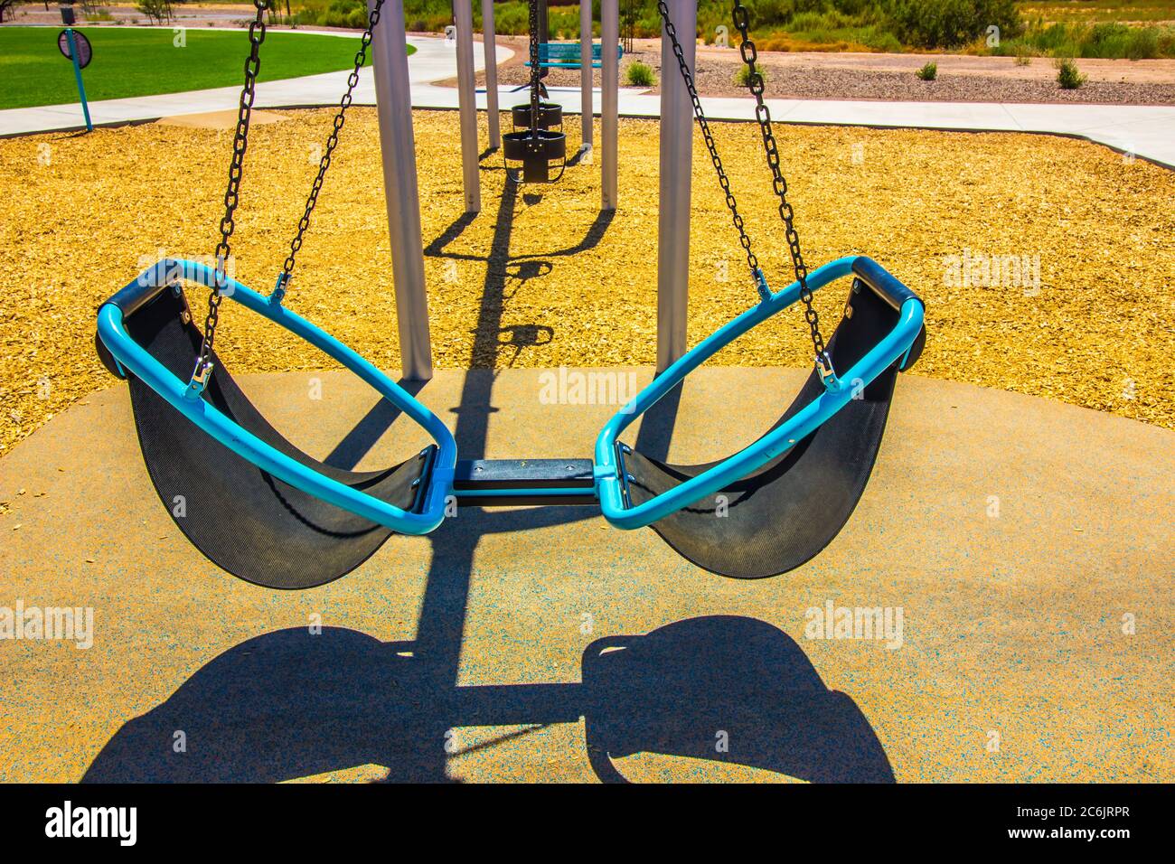 Dual Seats On Modern Swing Set In Free Public Park Stock Photo - Alamy