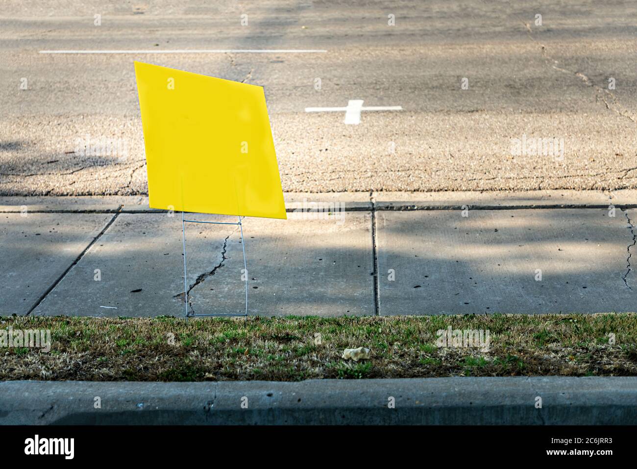 Yelliow empty placard, poster besides a road, copy space Stock Photo