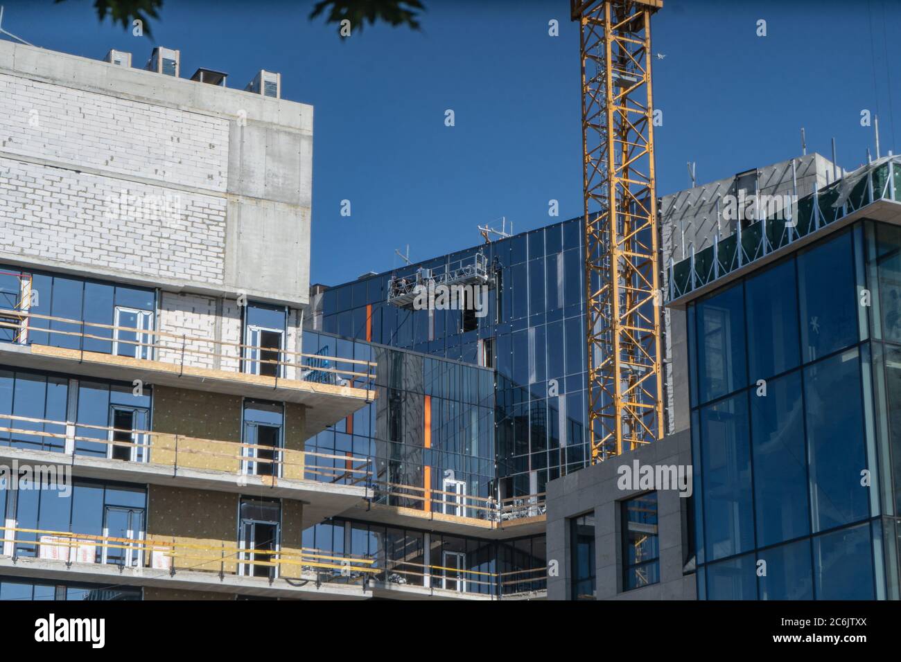 Construction of a new residential complex. High-rise building at a construction site on a sunny day. June 2020. Kiev, Ukraine Stock Photo