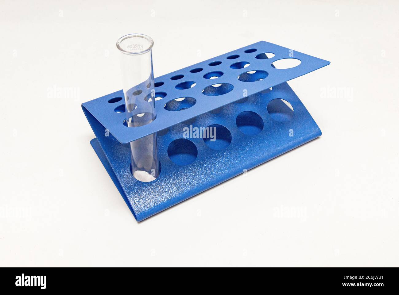 Double Displacement Reaction happening between baking soda and vinegar in a test tube sitting in a test tube rack. Stock Photo