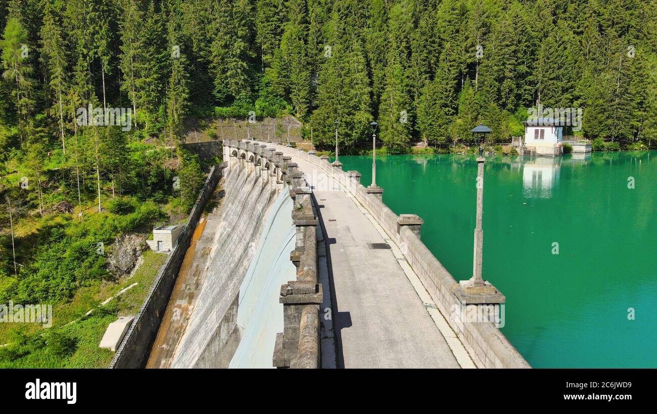 Alpin lake and dam in summertime, view from drone, Auronzo, italian dolomites. Stock Photo