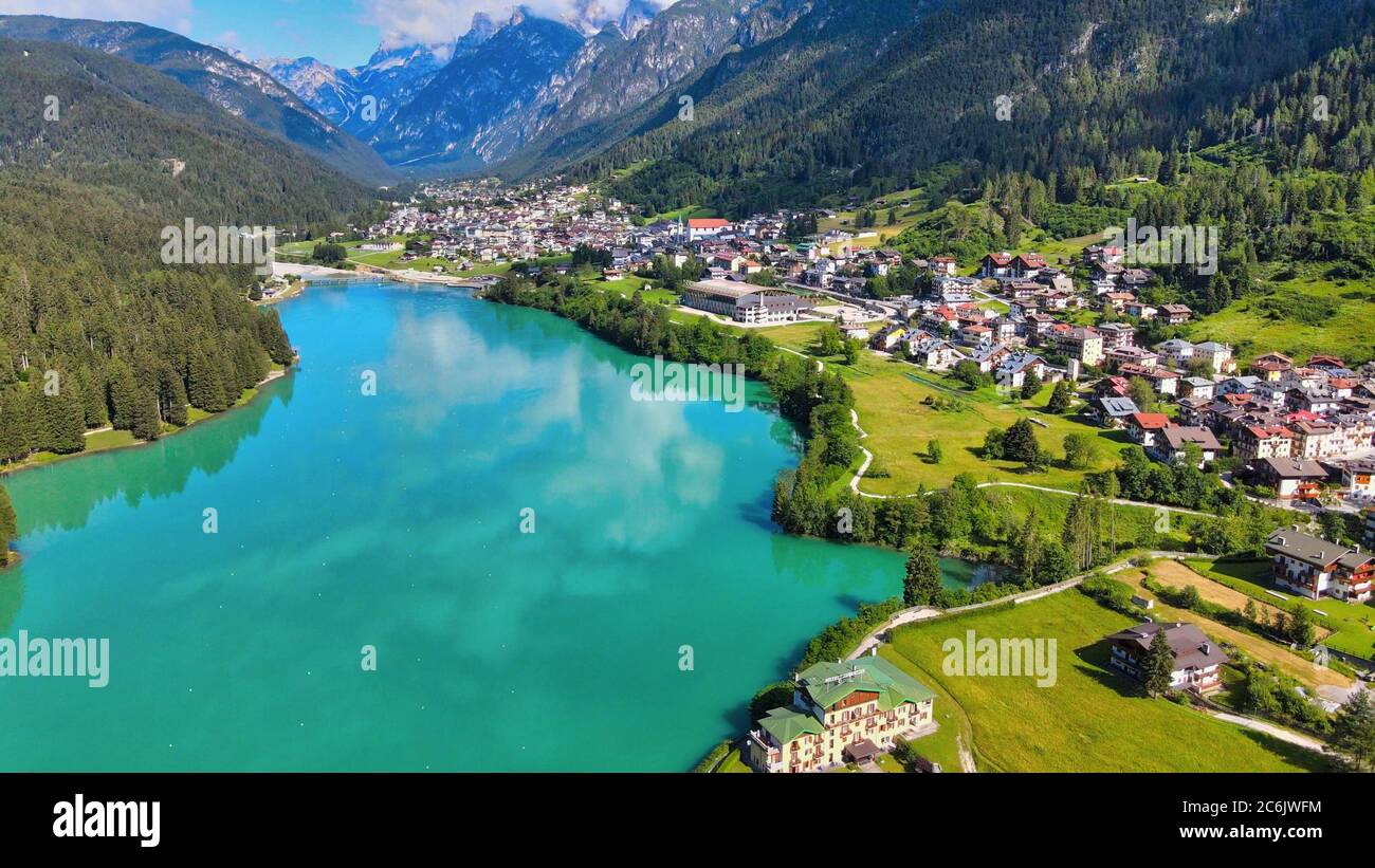 Aerial view of Auronzo Lake and Town in summertime, italian dolomites. Stock Photo