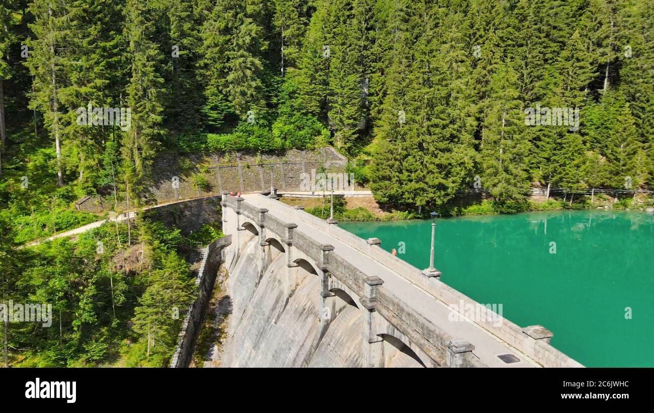 Alpin lake and dam in summertime, view from drone, Auronzo, italian dolomites. Stock Photo