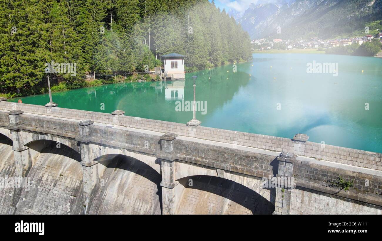 Alpin lake and dam in summertime, view from drone, Auronzo, italian dolomites. Stock Photo