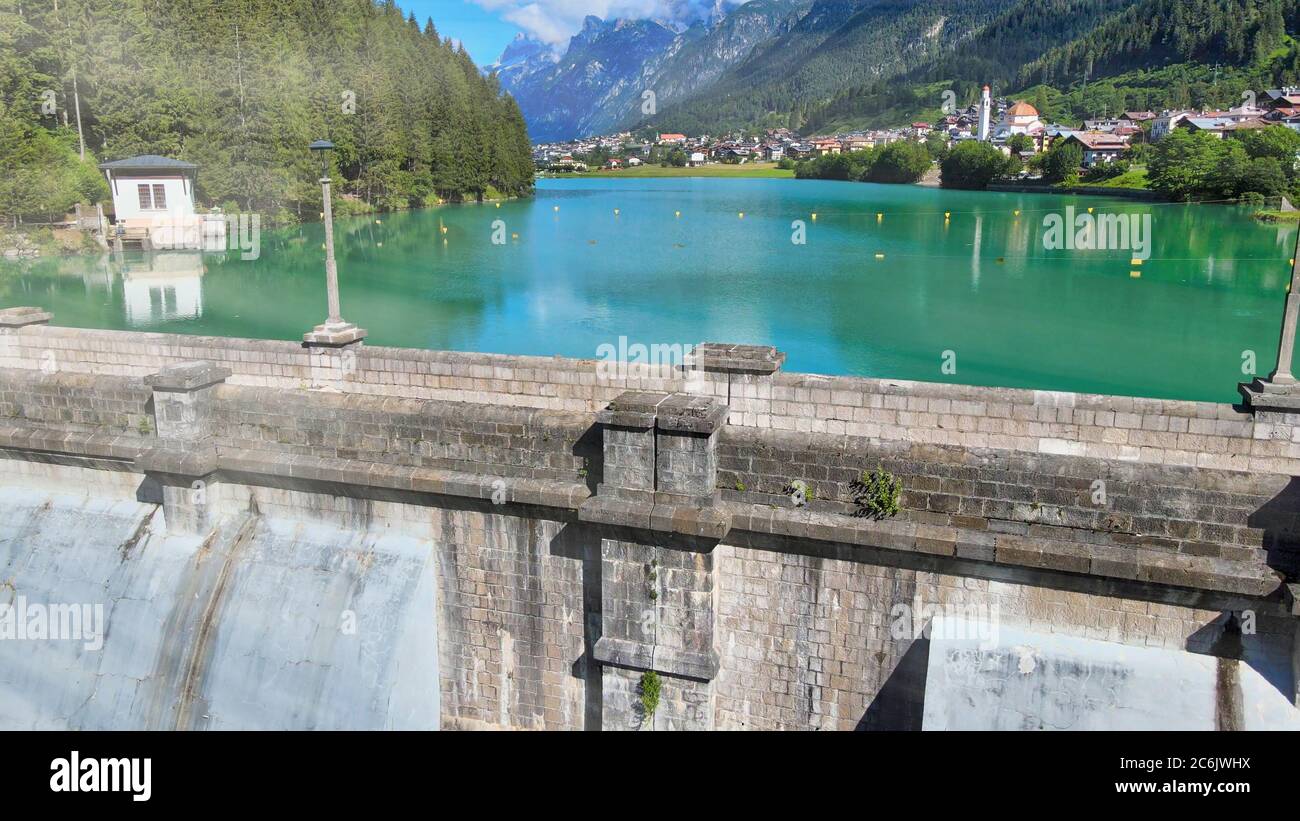 Alpin lake and dam in summertime, view from drone, Auronzo, italian dolomites. Stock Photo