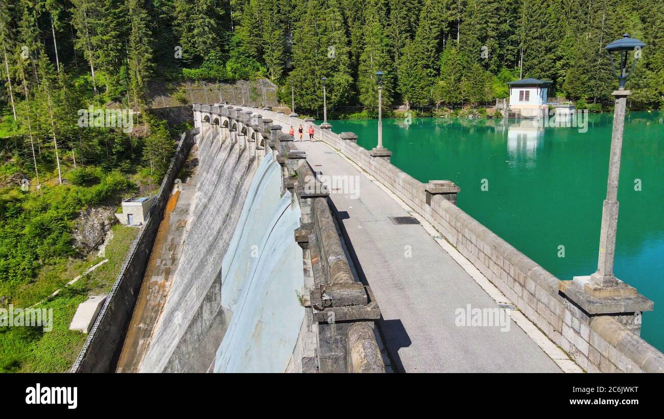 Alpin lake and dam in summertime, view from drone, Auronzo, italian dolomites. Stock Photo