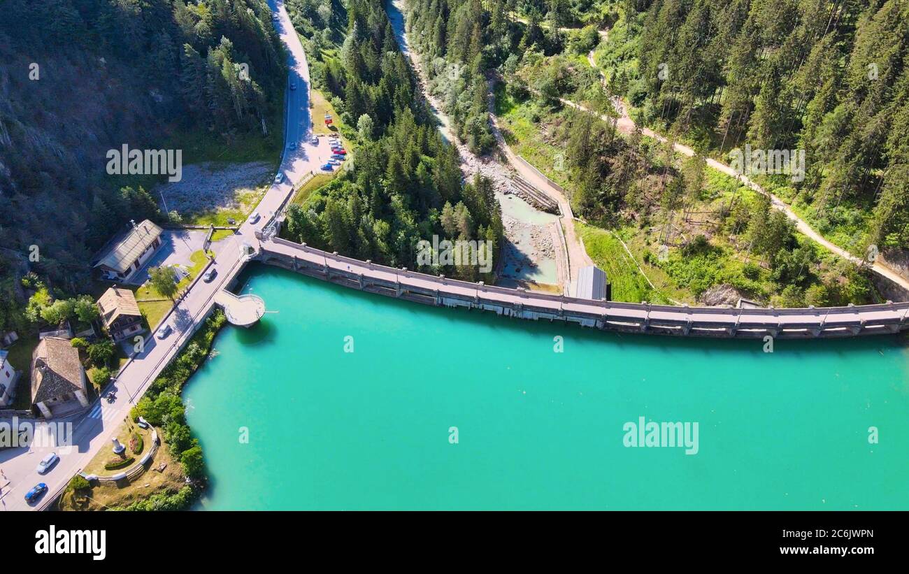 Alpin lake and dam in summertime, view from drone, Auronzo, italian dolomites. Stock Photo