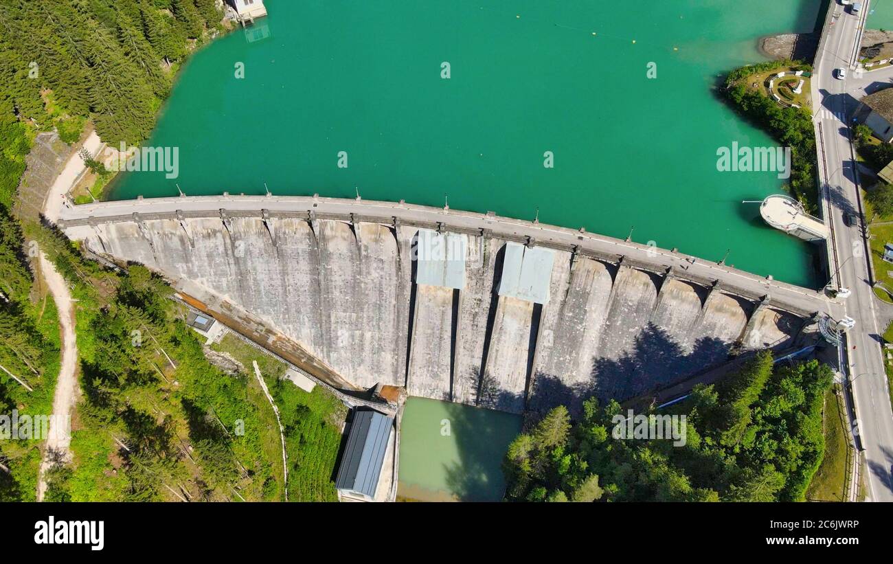 Alpin lake and dam in summertime, view from drone, Auronzo, italian dolomites. Stock Photo