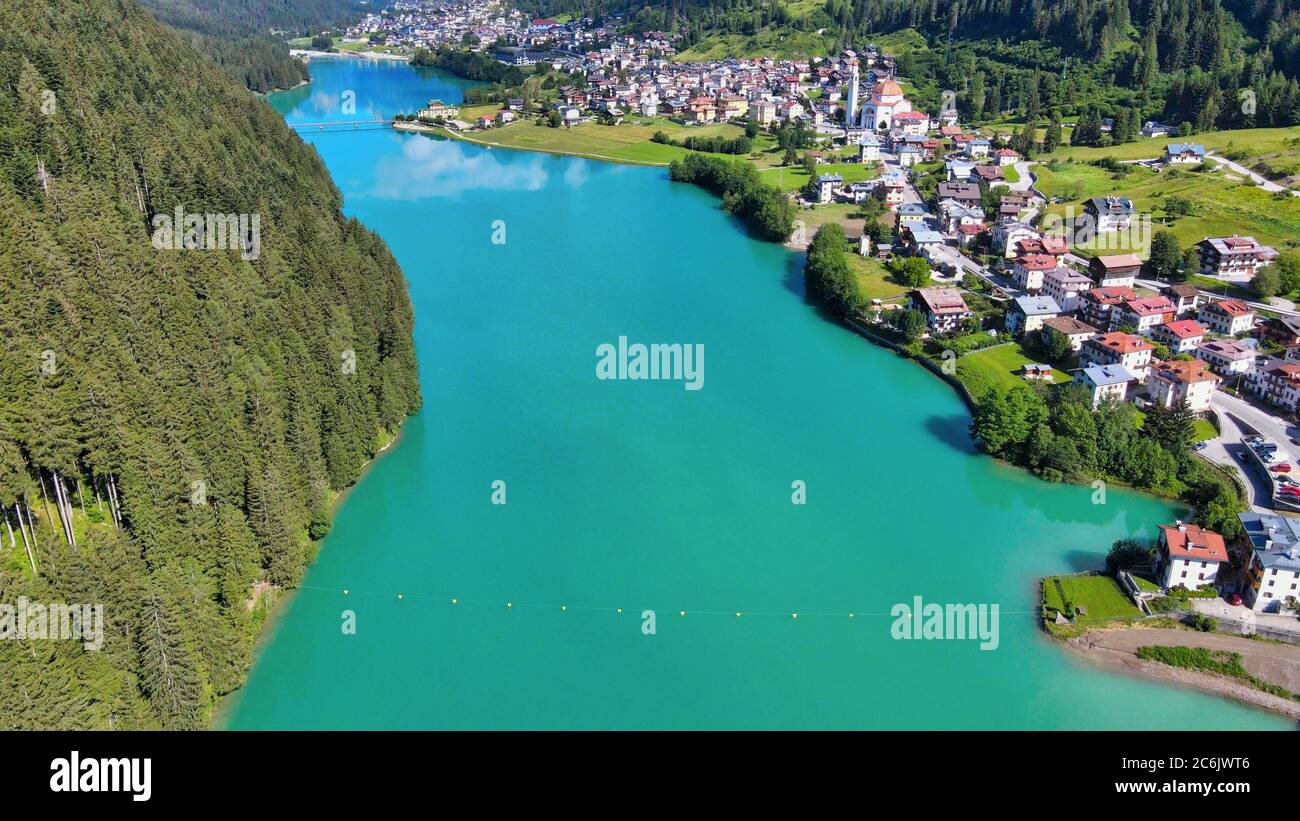 Alpin lake and dam in summertime, view from drone, Auronzo, italian dolomites. Stock Photo