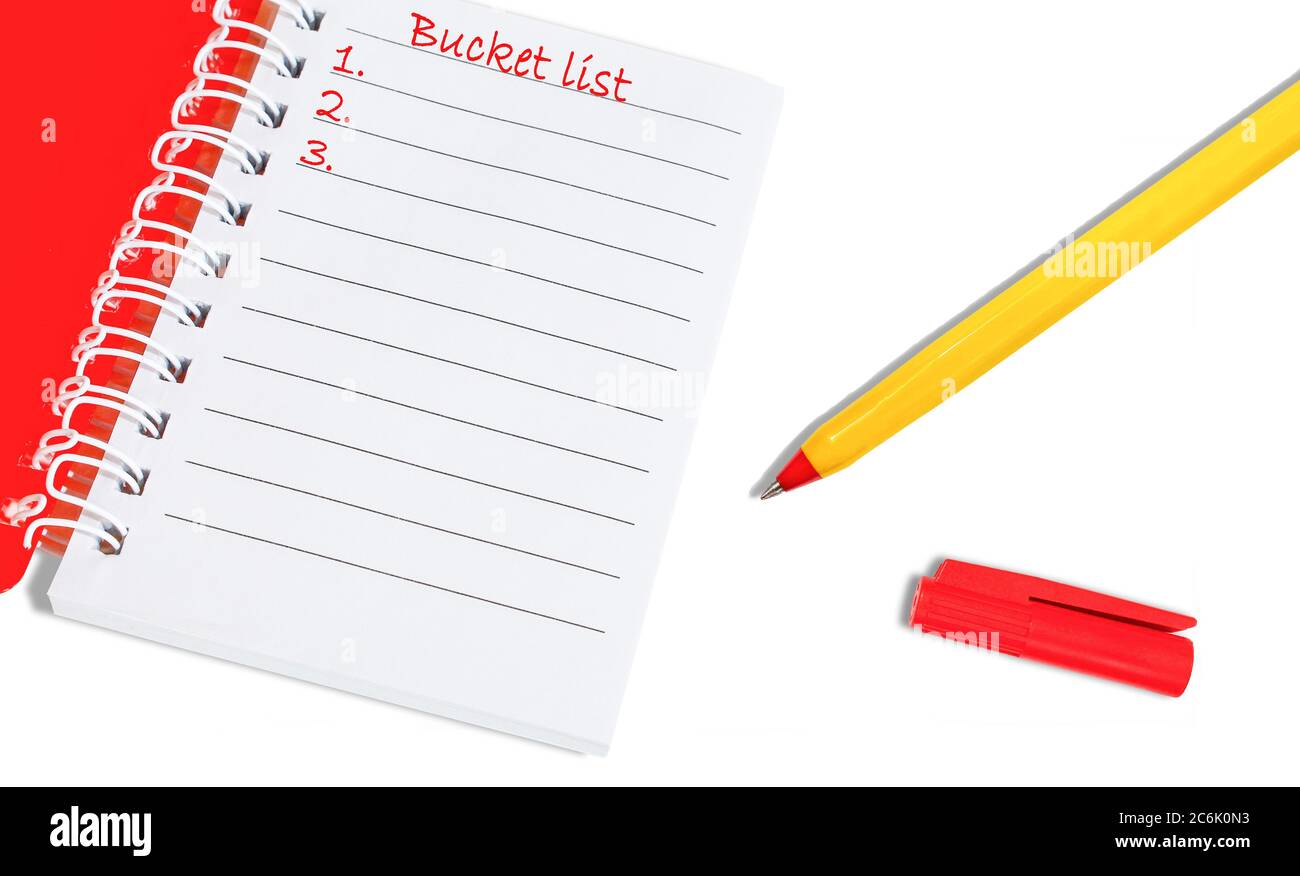 Bucket list notebook with yellow pen and red cap. Mock up, template close up Stock Photo