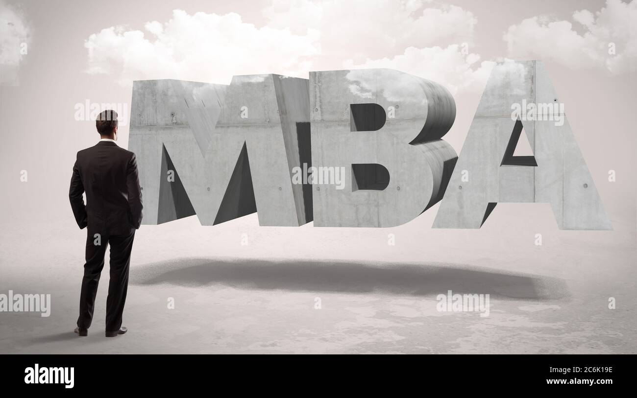 Rear view of a businessman standing in front of MBA abbreviation ...