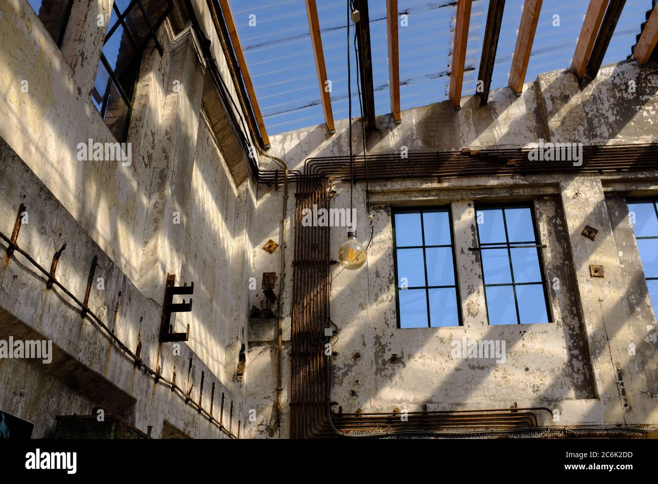 The interior of an abandoned industrial warehouse building on old industrial park called Hembrug in the netherland Stock Photo