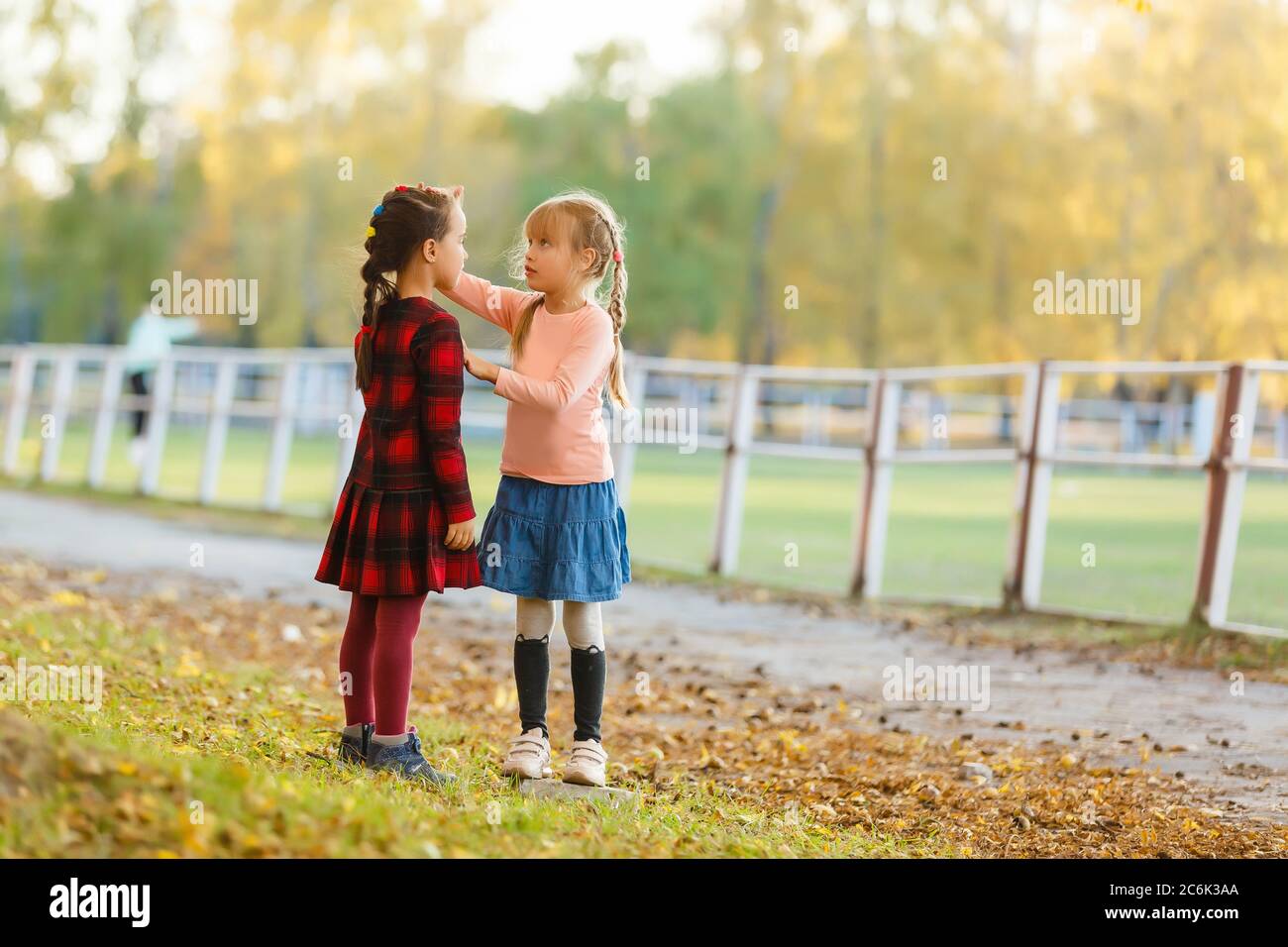 two little girls in autumn park Stock Photo - Alamy