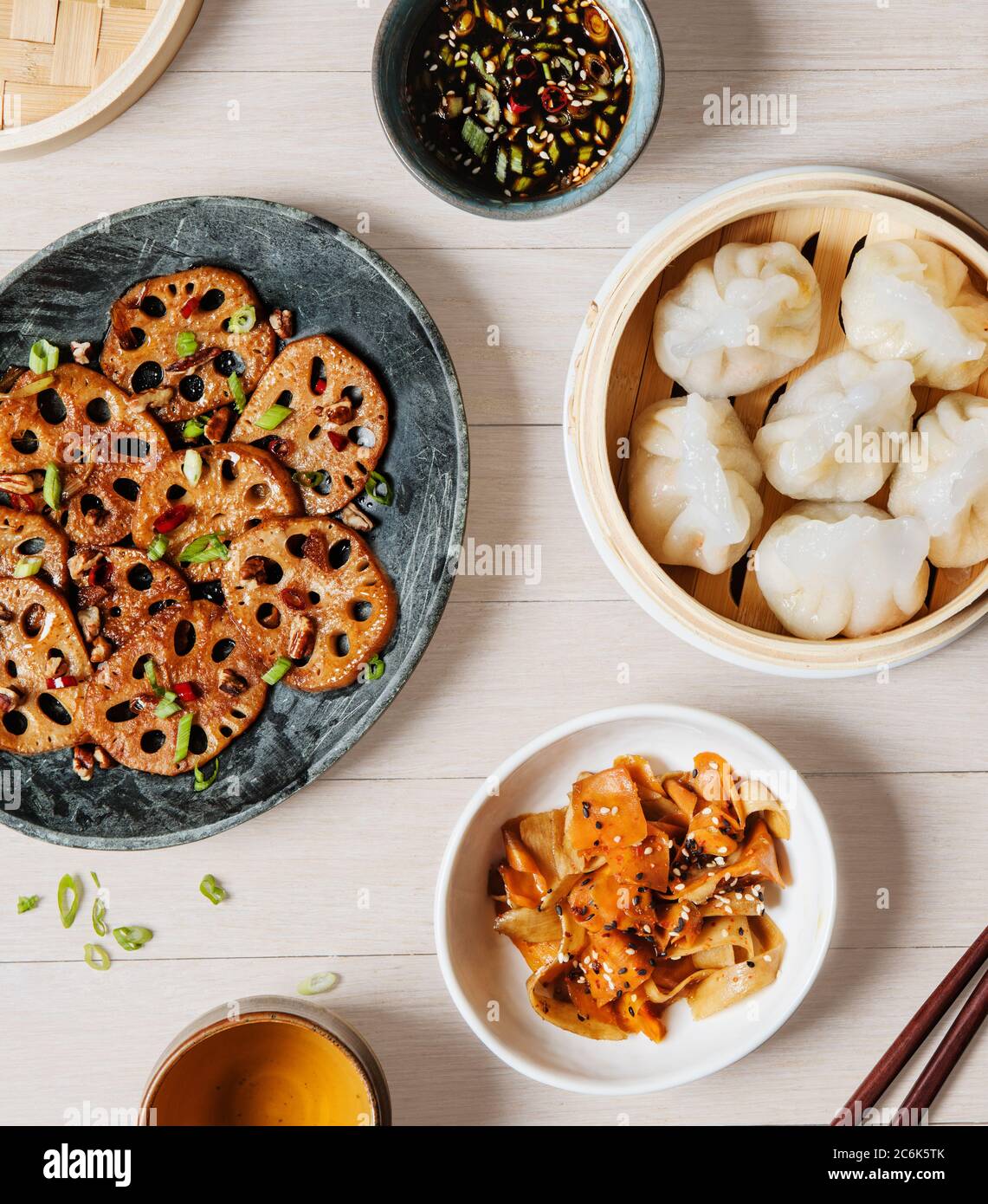 Asian appetizers including Lotus root, steamed vegetable dumplings, and