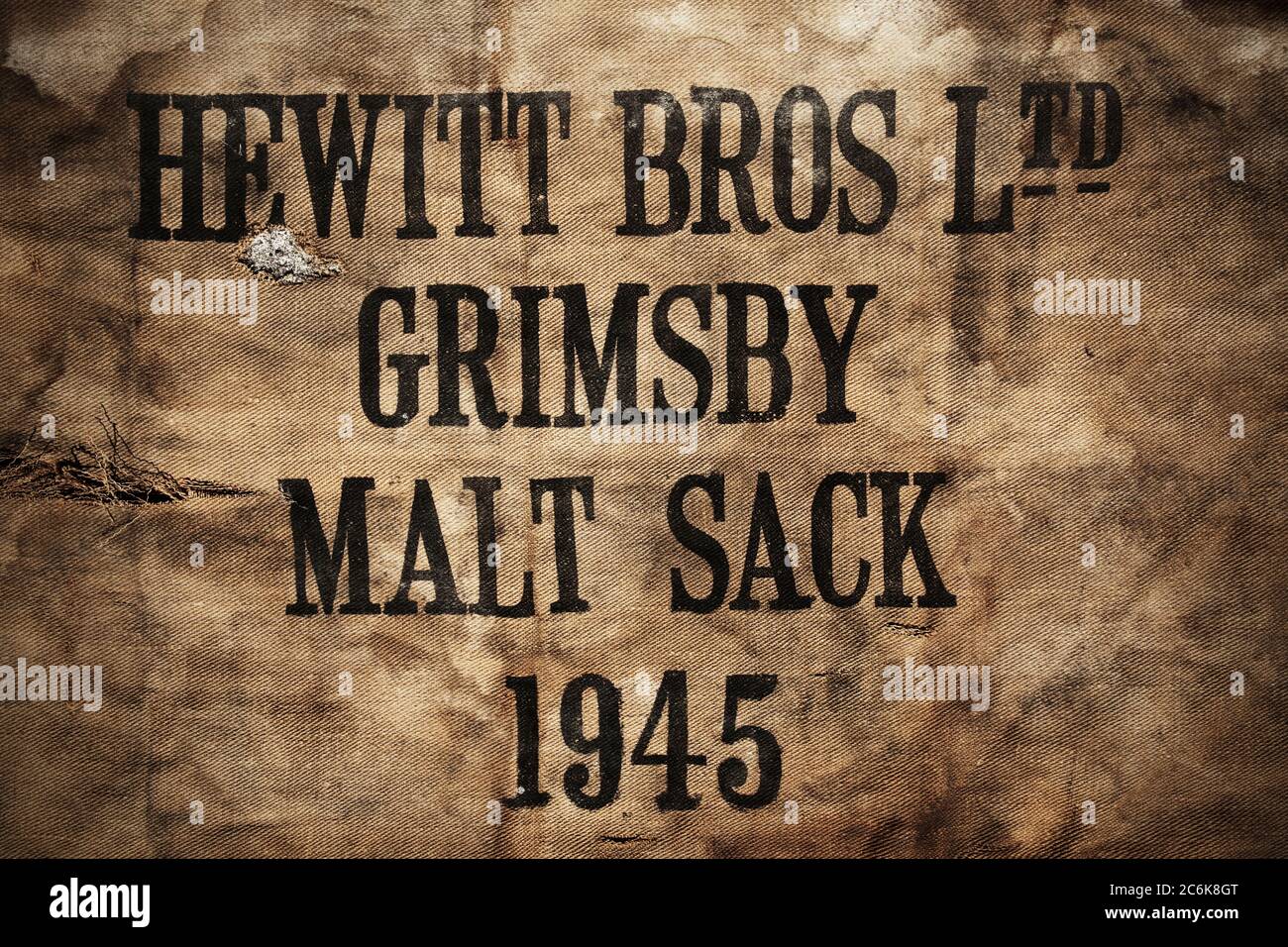 Old hessian sack used by Hewitt Brothers brewery of Grimsby, UK. Stock Photo
