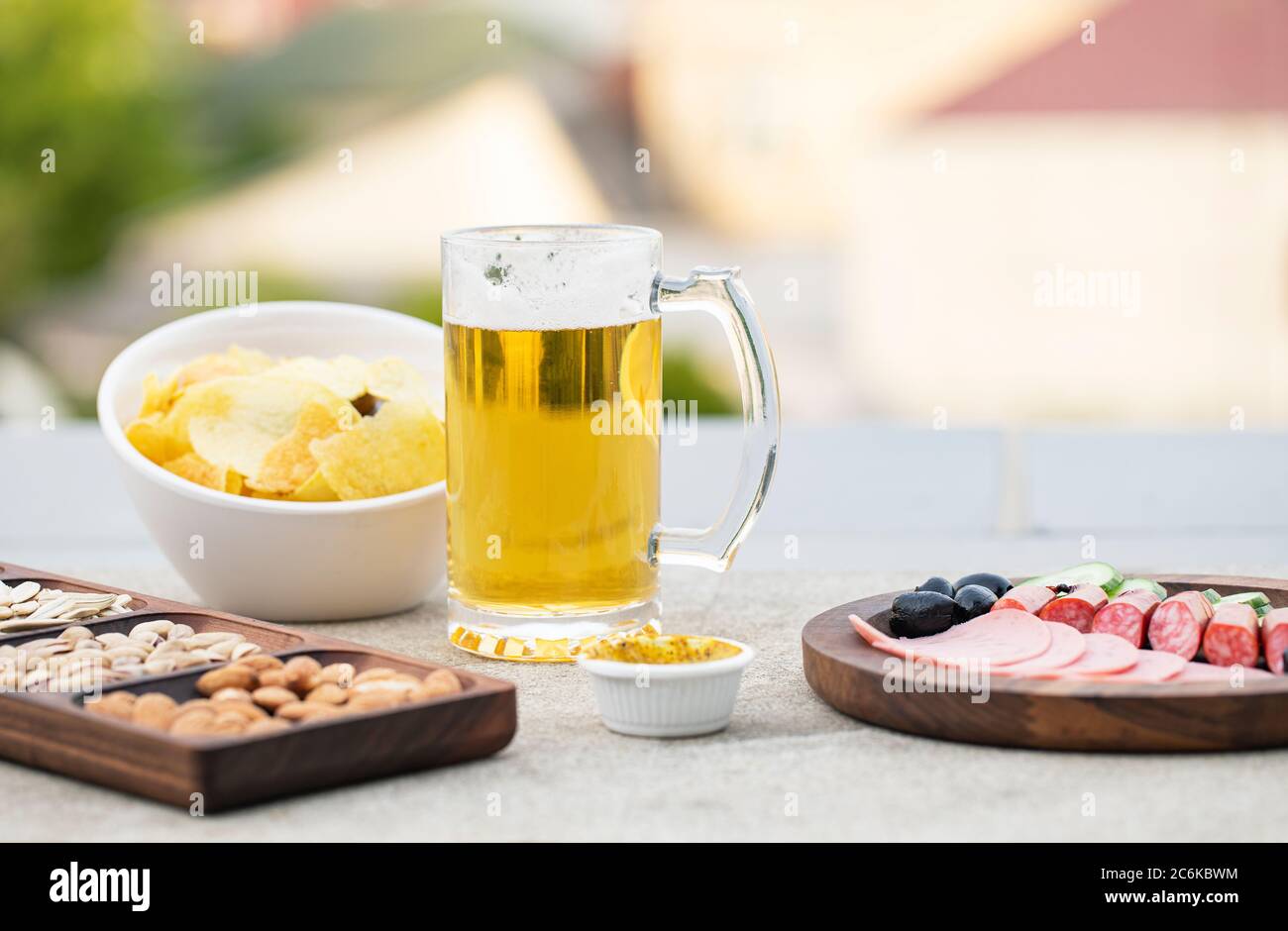 Sausage salad with snacks and beer Stock Photo