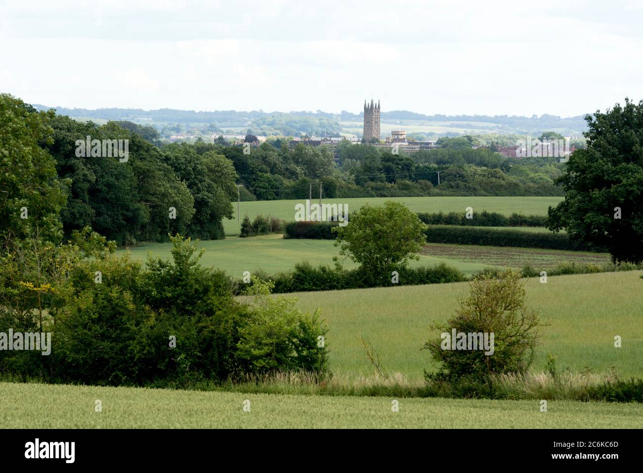 Warwickshire countryside in summer with distant view of Warwick town centre, England, UK Stock Photo