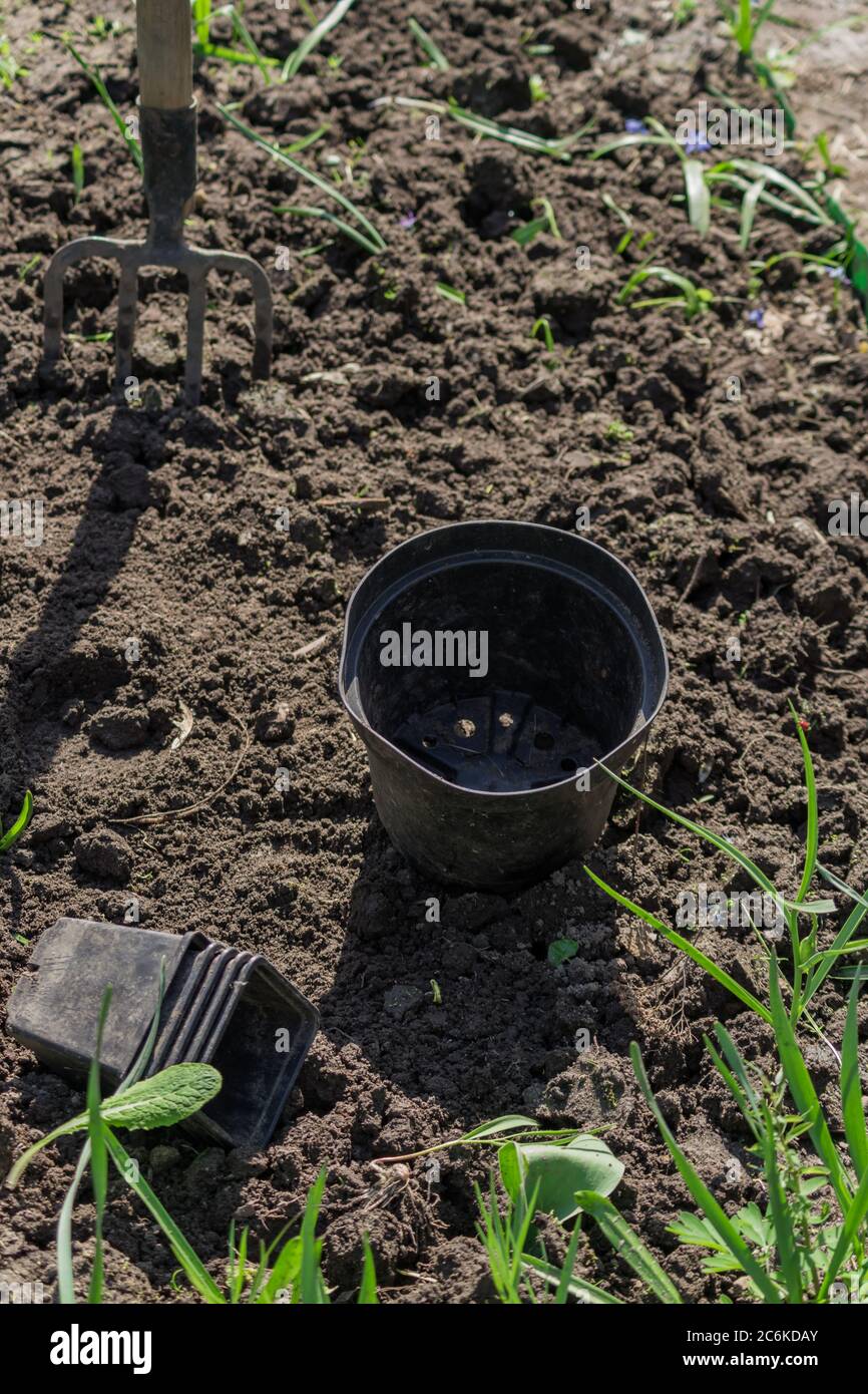 empty plastic flower pots on the ground Stock Photo
