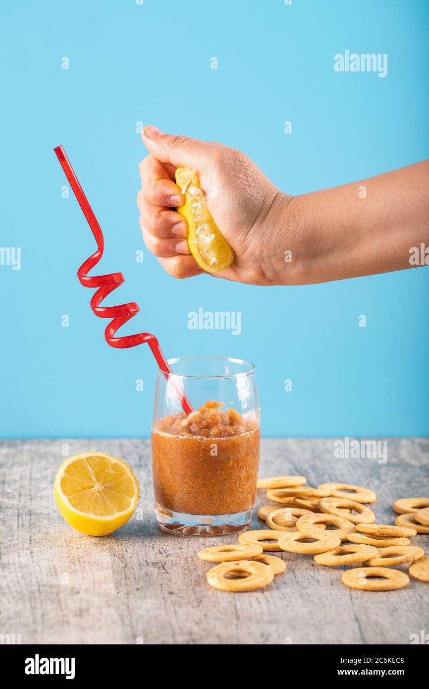 Adding lemon juice to apple jam Stock Photo Alamy