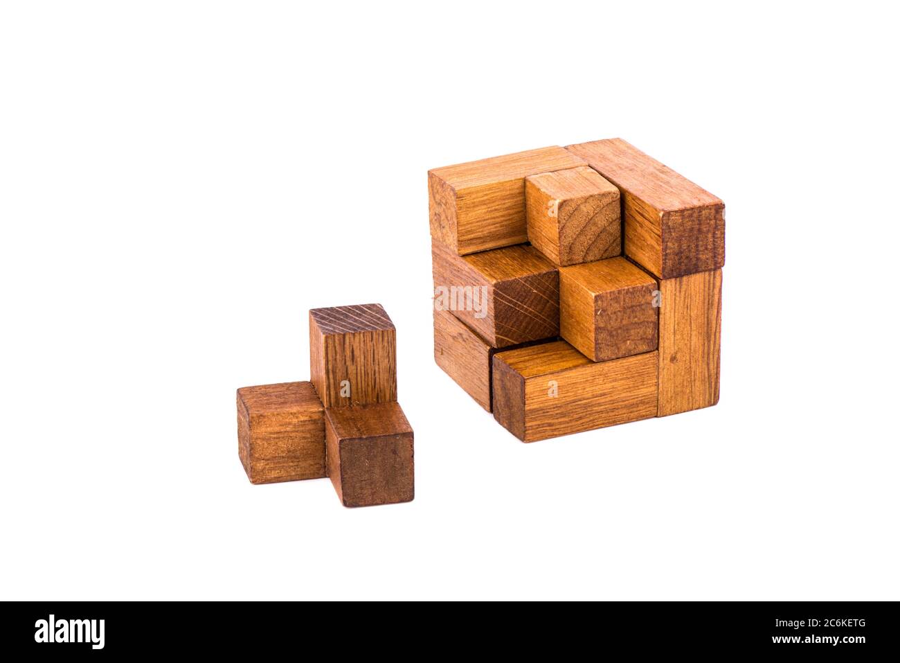 Incomplete wooden puzzle cube 7. Wooden puzzle consisting of 7 parts  isolated on a white background. Copy space Stock Photo - Alamy