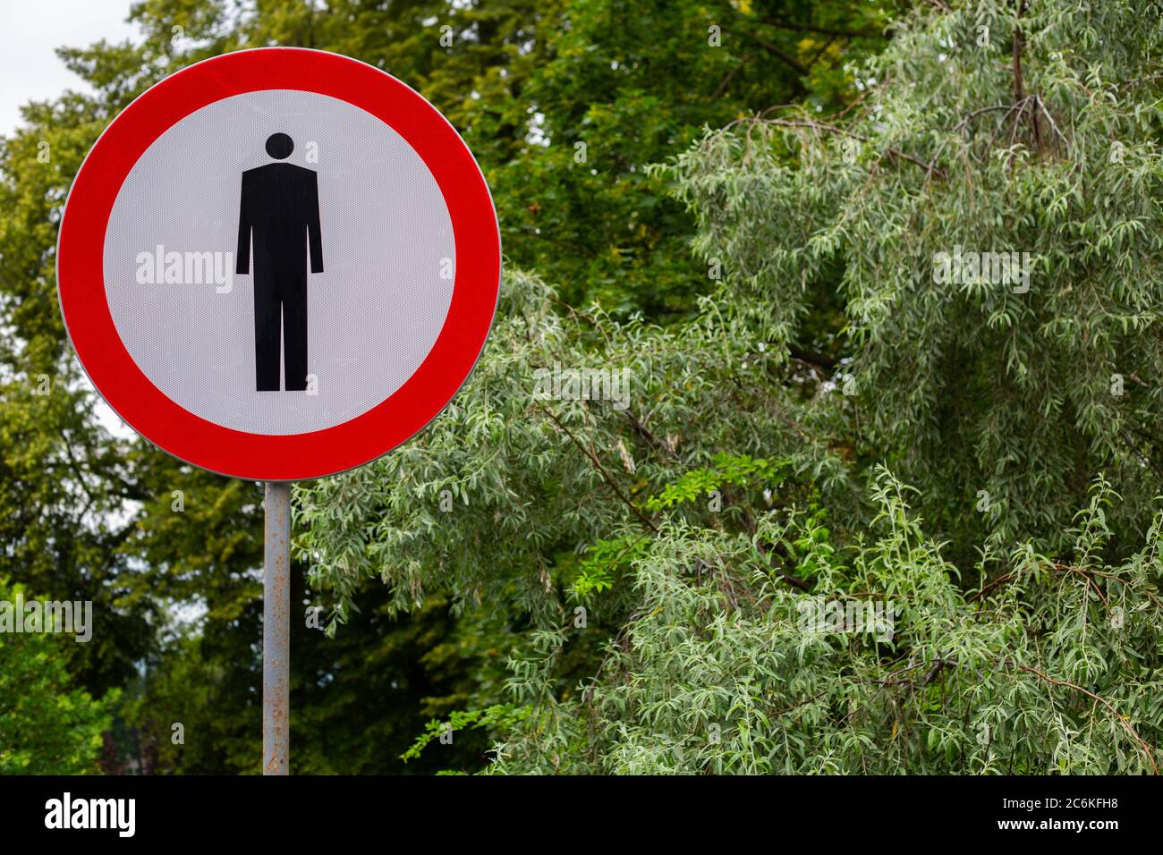 sign - No pedestrians sign - on a background of green trees Stock Photo ...