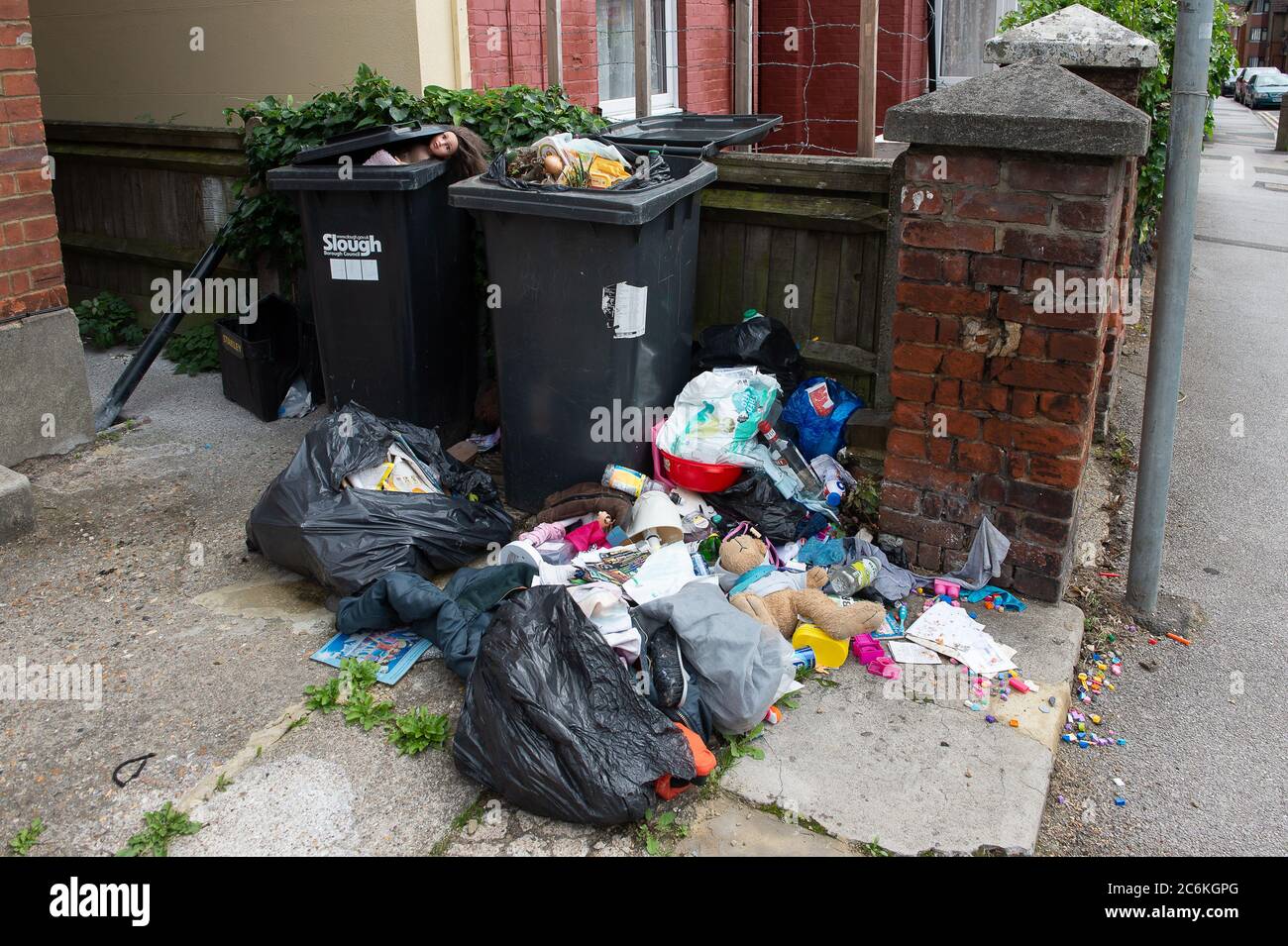 Slough, Berkshire, UK. 10th July, 2020. Overflowing rubbish outside a