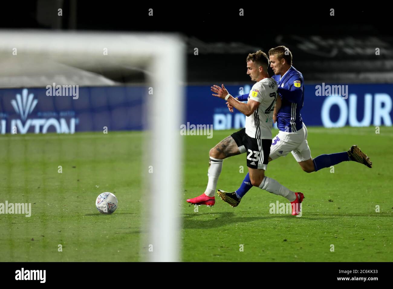 Craven Cottage, London, UK. 10th July, 2020. English Championship Football, Fulham versus Cardiff City; Joe Bryan of Fulham competes for the ball with Danny Ward of Cardiff City Credit: Action Plus Sports/Alamy Live News Stock Photo