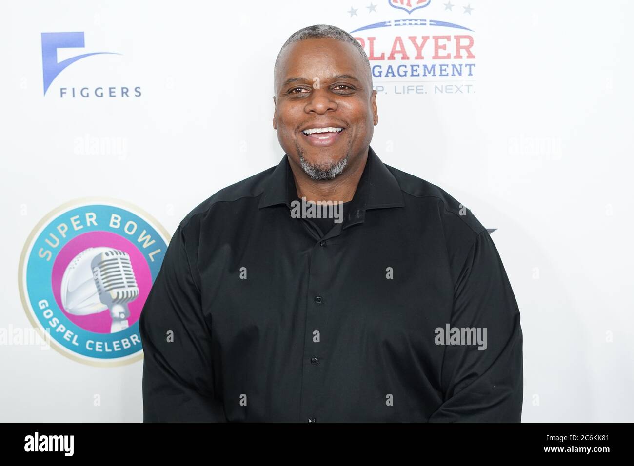 former-nfl-player-tim-walton-pose-for-pictures-during-the-21st-annual-super-bowl-gospel-celebration-red-carpet-at-the-james-l-knight-center-in-miami-florida-on-thursday-january-30-2020