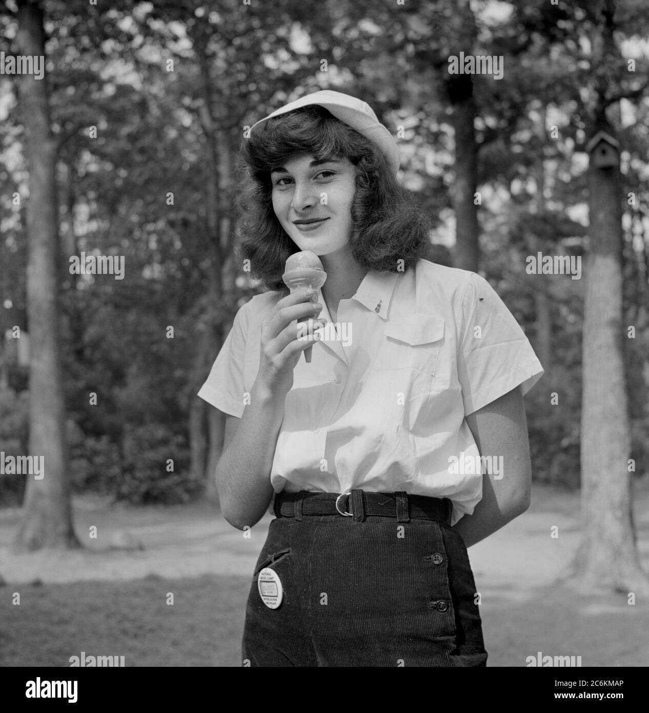 Teen Girl eating Ice Cream, National Music Camp, Interlochen, Michigan, USA, Arthur S. Siegel, U.S. Farm Security Administration, August 1942 Stock Photo