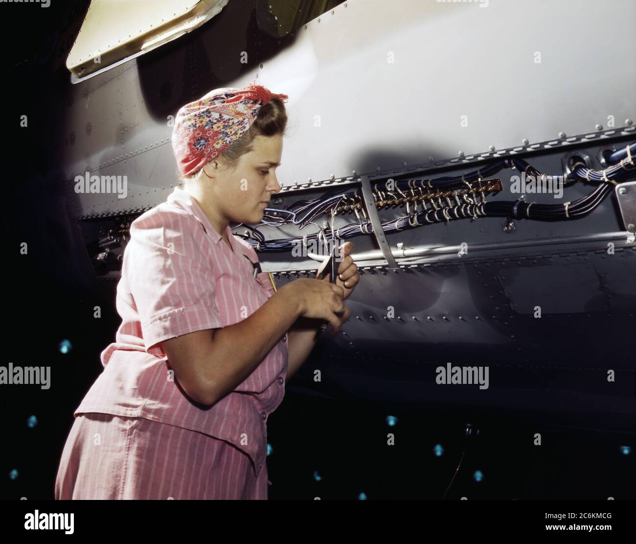 Woman working at Electrical Assembly and Installation, Douglas Aircraft Company, Long Beach, California, USA, Alfred T. Palmer, U.S. Office of War Information, October 1942 Stock Photo