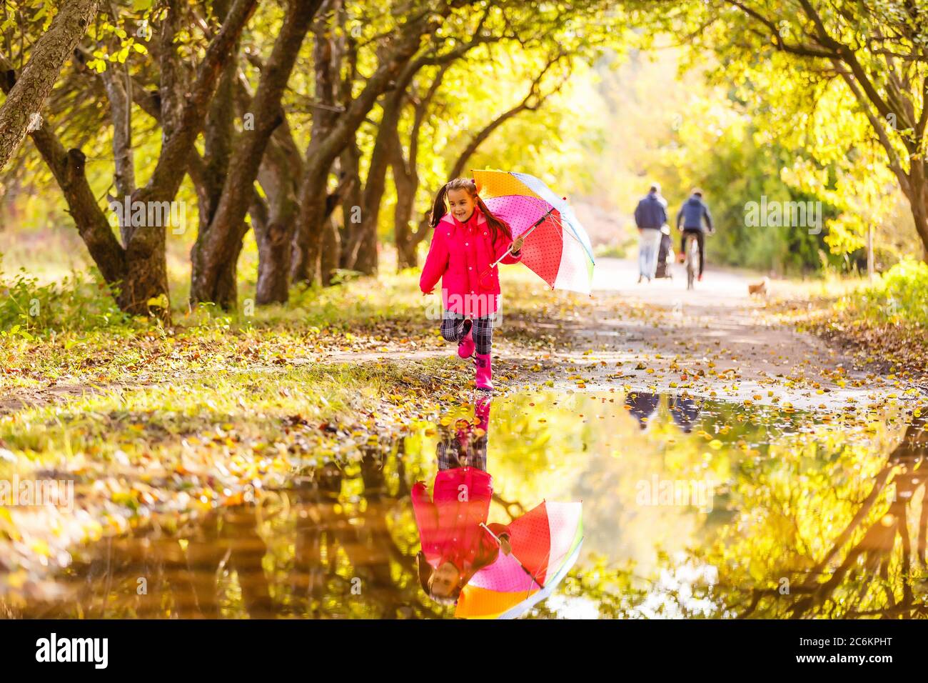 Little girl with umbrella on a rainy day Stock Photo - Alamy