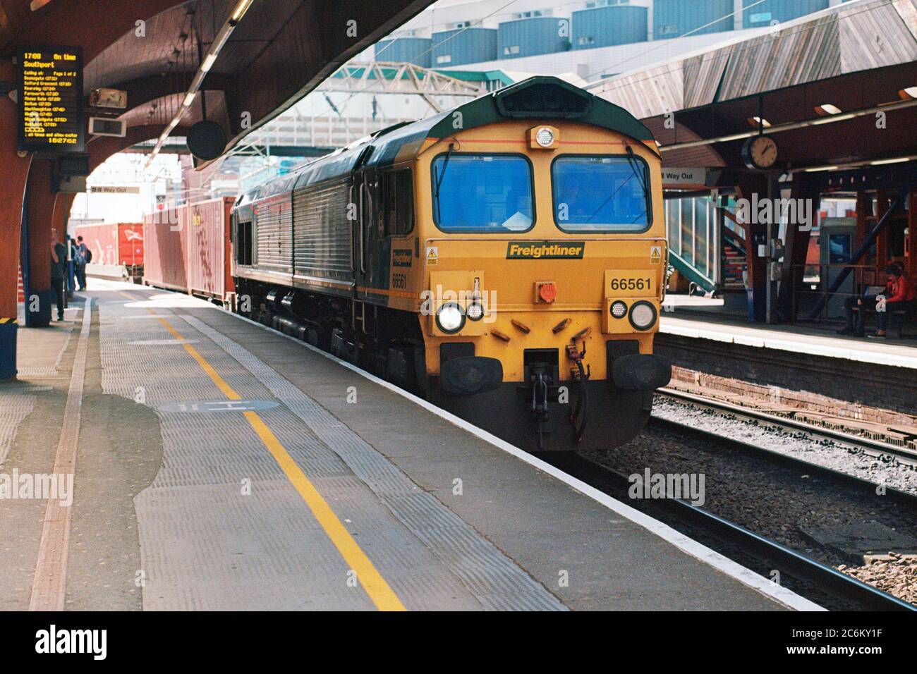 Manchester, UK - 6 July 2020: A freight train operating by Freightliner through Manchester Oxford Road Station platform 3. Stock Photo