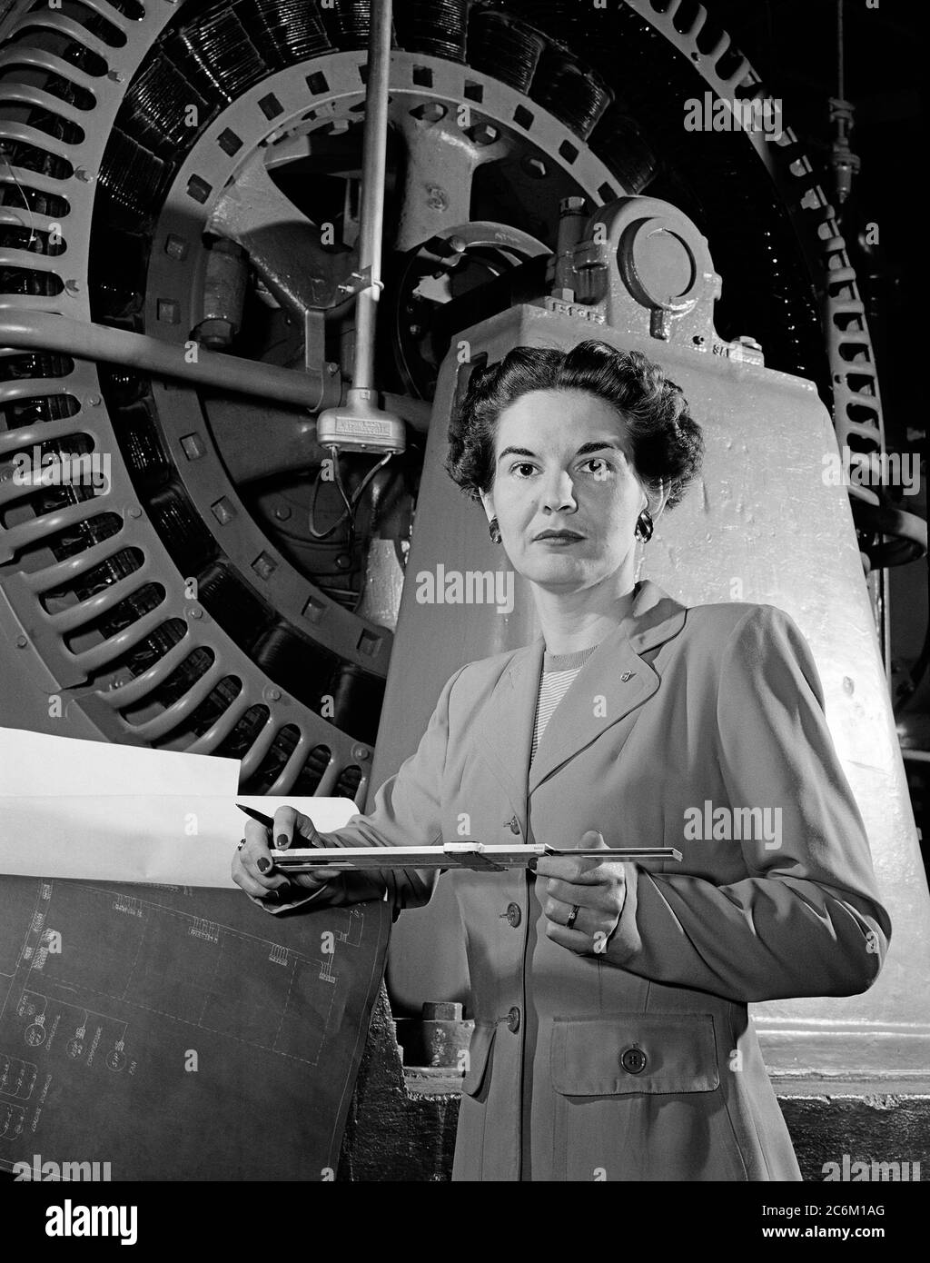 1952 , USA : The american Electrical Engineer woman KITTY Wingfield O'BRIEN JOYNER ( 1916 - 1993 ) of NASA ,  at work , expert in Electronics , at LANGLEY RESEARCH CENTER .  In this photo analyzing the operation of a wind tunnel turbine at NACA Langley in 1952 . Remembered like the first woman engineer at the Memorial Langley Aeronautical Laboratory . - NASA - N.A.S.A. - The National Aeronautics and Space Administration - foto storiche - foto storica  - scienziato - scientist  - INGEGNERE  DONNA  - INGEGNERIA ELETTRONICA - DONNE DONNA - AL LAVORO - AERONAUTICA - REGOLO MATEMATICO ALGEBRICO LOG Stock Photo