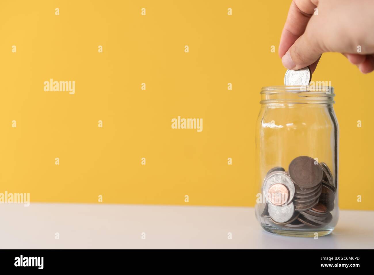 The jar full of coin and bank notes meaning of saving money investment business finance concept