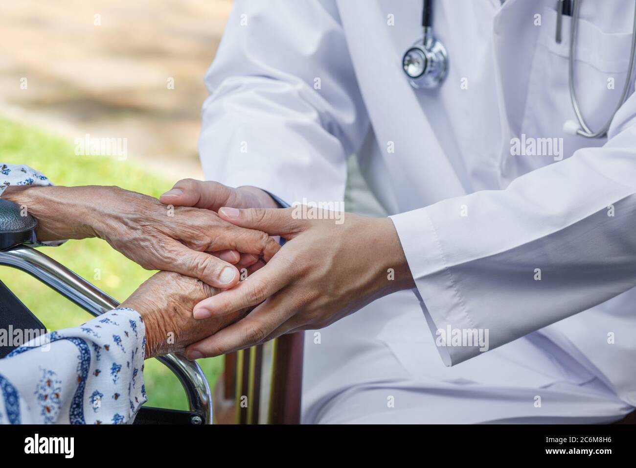 Doctor is encouraging elderly to keep healthy Stock Photo