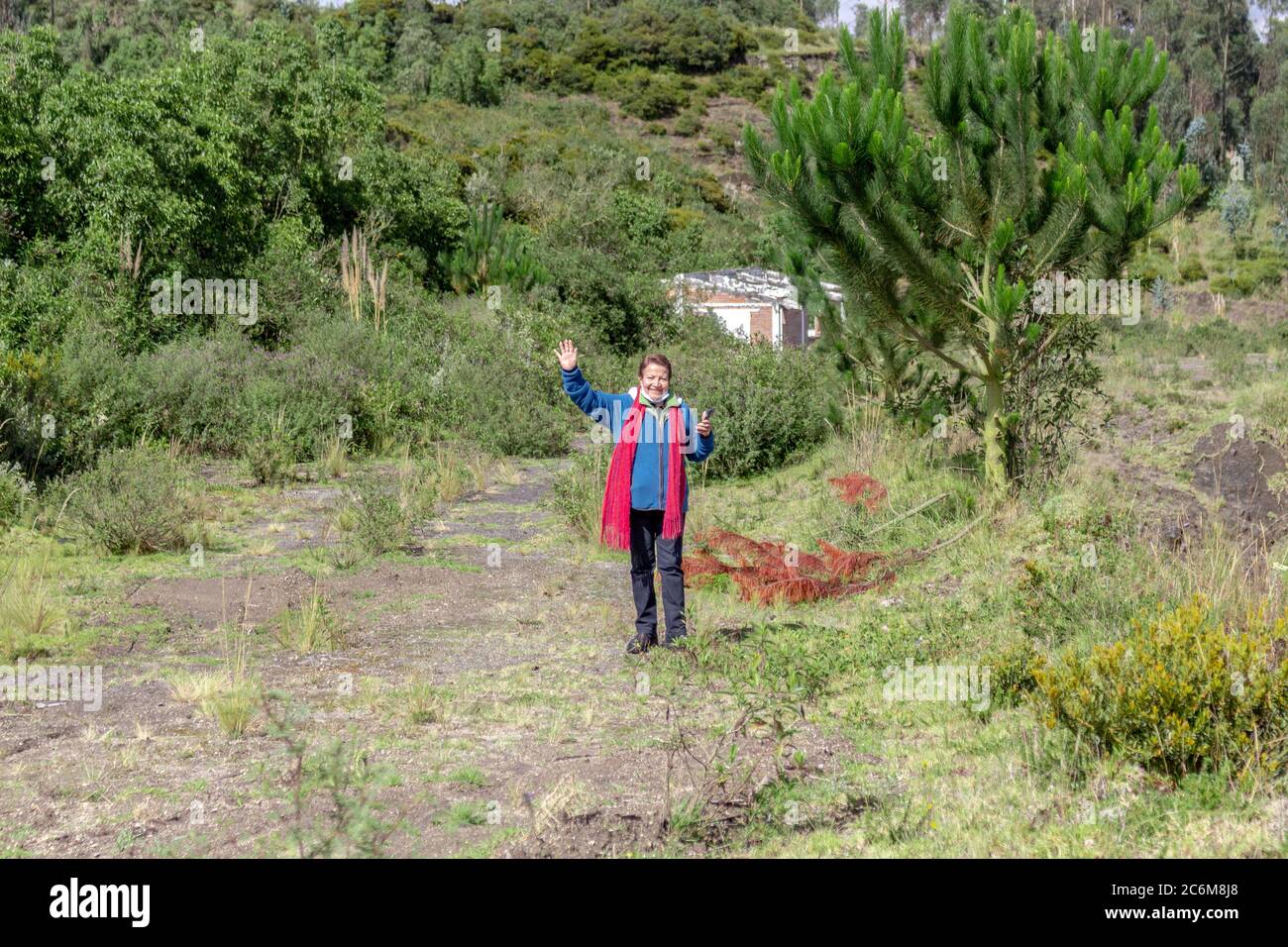 Mature woman smiling waving in hi-res stock photography and images - Alamy