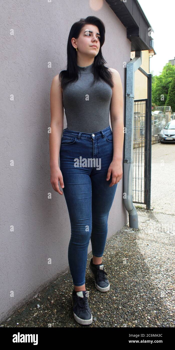 Young black haired girl posing outside Stock Photo