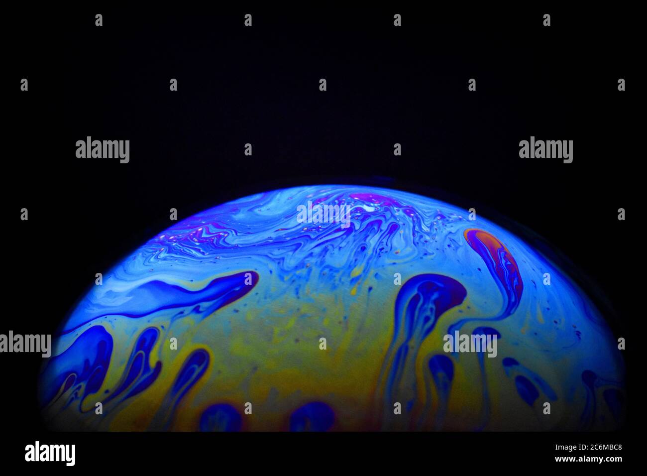 Light diffraction on soap bubble surface. Meteorological model. Stock Photo