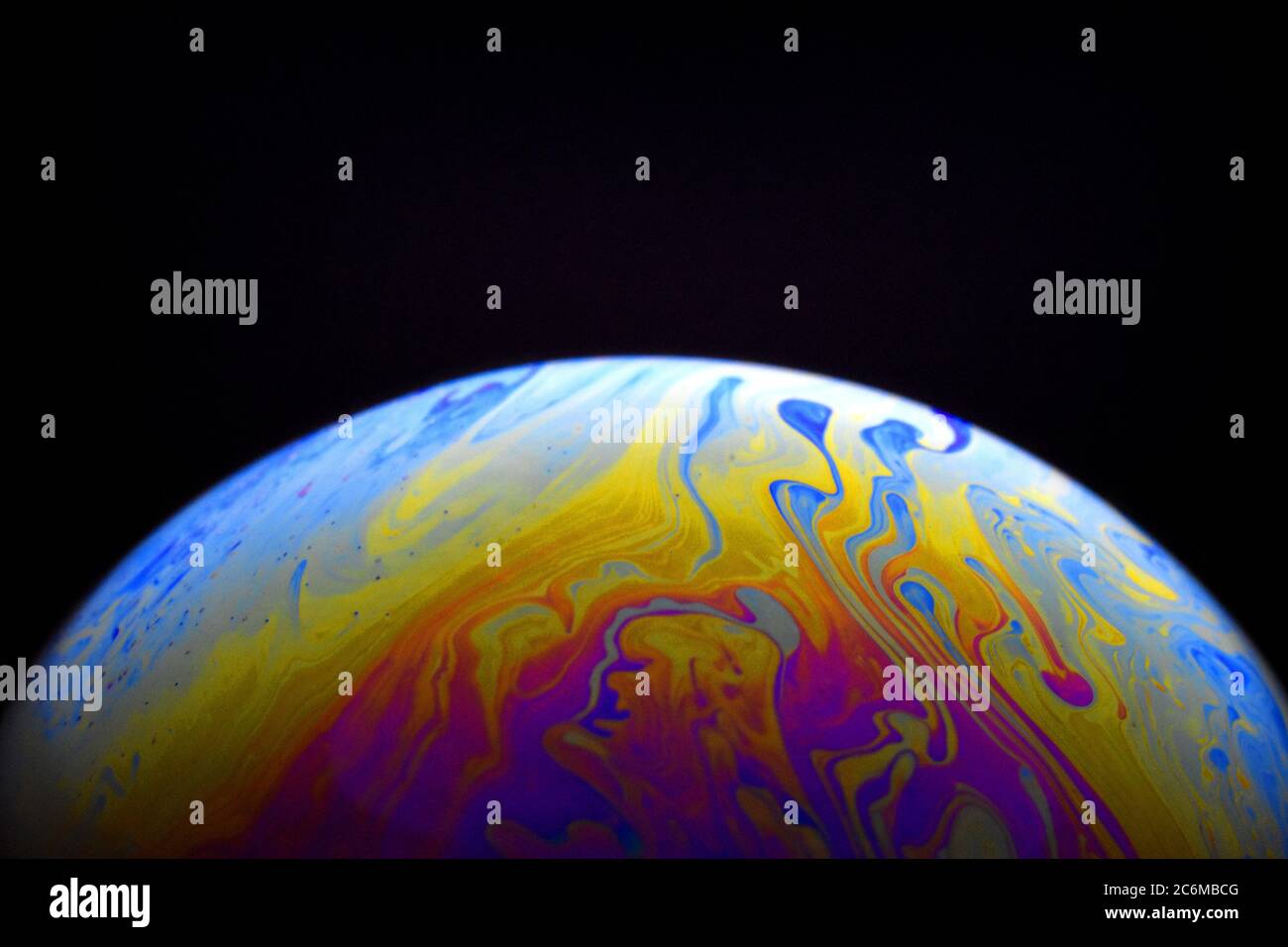Light diffraction on soap bubble surface. Meteorological model. Stock Photo