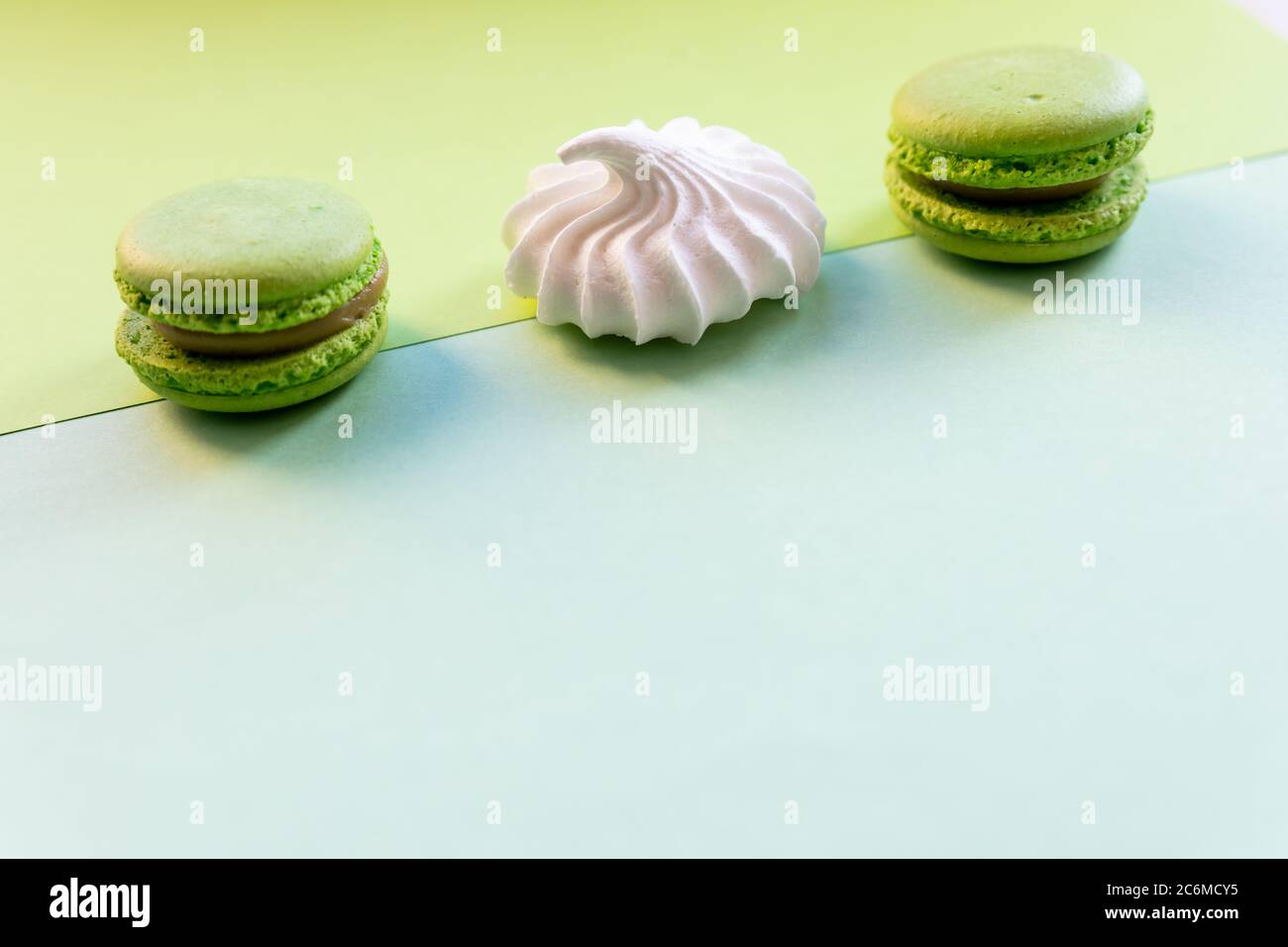 flat lay of colorful unstable french macaroon cookies like background, dessert concept.Pop Art Color style with meringue and bakery goodies on bright Stock Photo