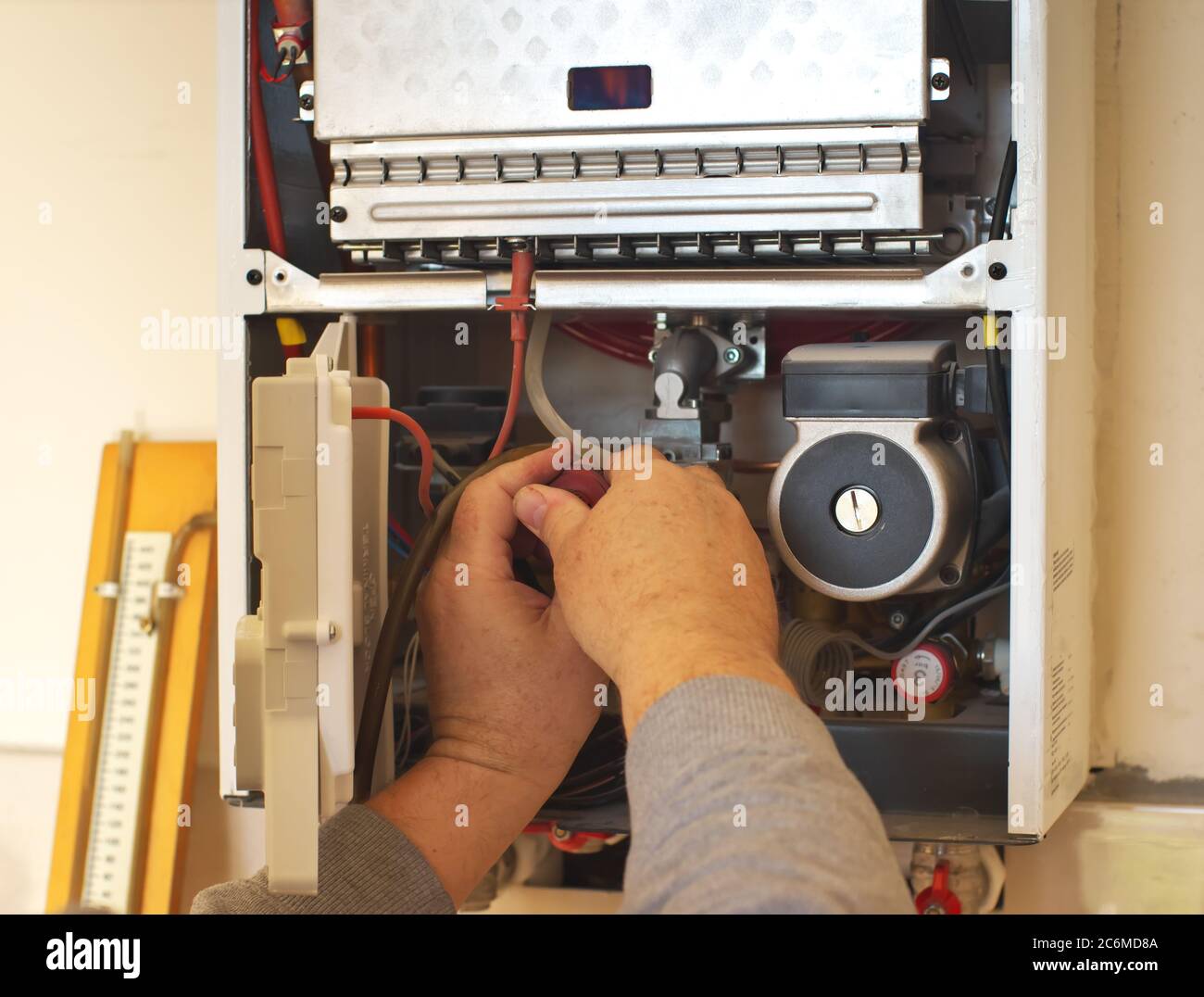 Man engineer and gas heater. Repair and work scene Stock Photo Alamy