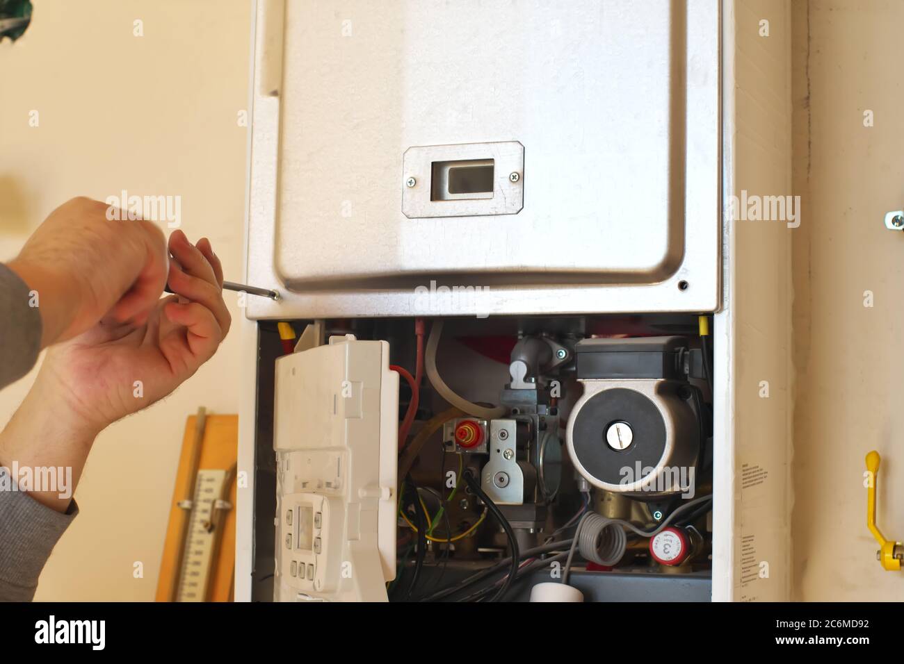 Man engineer and gas heater. Repair and work scene Stock Photo Alamy