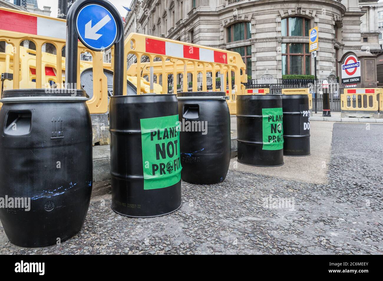 Extinction Rebellion protested outside the Bank Of England by pouring fake petroleum on the street to highlight the bailout of the big corporations. Stock Photo