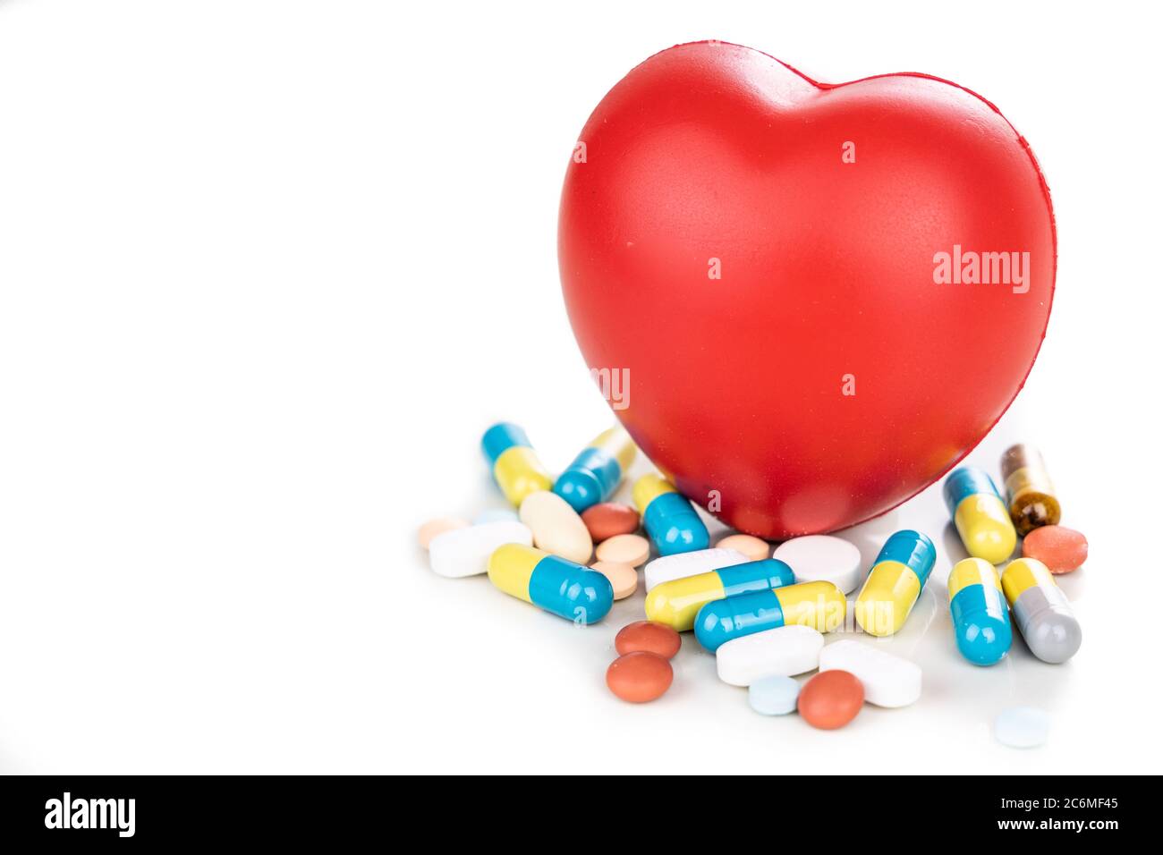 Healthcare concept with medicine pills, caplet, tablet, capsule and red