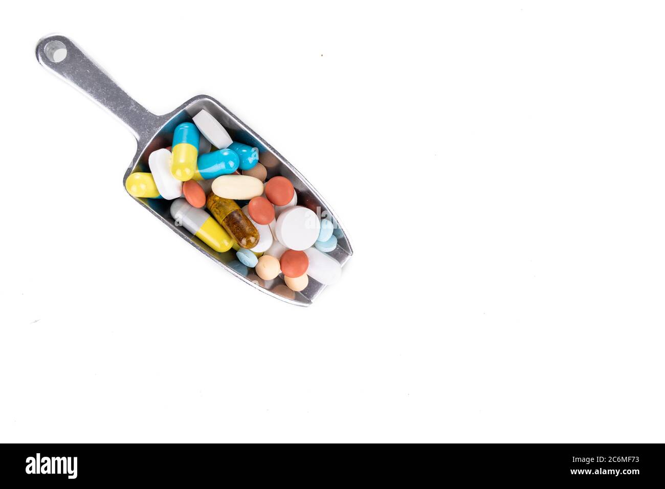 Healthcare concept on ladle with overhead view on scoop of various