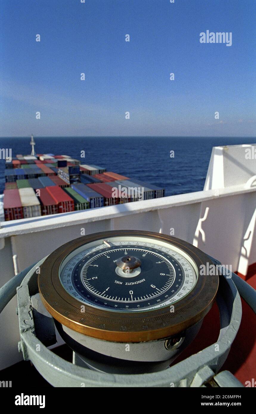 sulu sea 22.30 s  040.45 w, international waters - march 01, 2006: view onto the gyro repeater compass at the portside bridge wing and deck stowed con Stock Photo