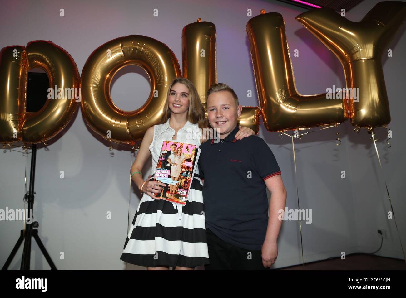 2014 DOLLY Model search winner, 14-year-old Mary Stickley from Wooloowin, QLD with Robbie from The Voice Kids. Stock Photo