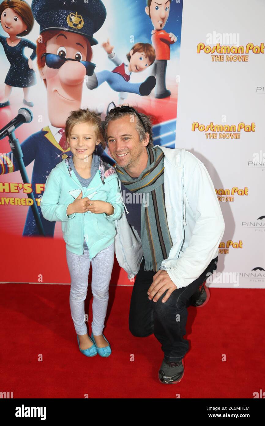 Australian actor Ian Stenlake and daughter Tahlula on the red carpet at the Postman Pat movie at Hoyts Entertainment Quarter, Moore Park in Sydney. Stock Photo